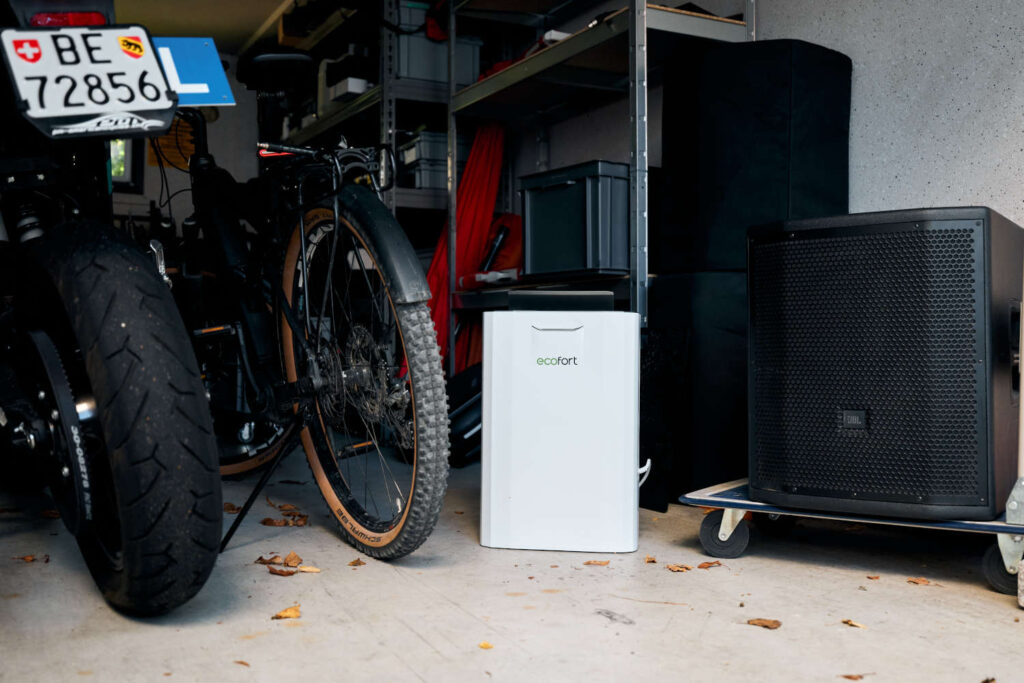ecoQ DryAir 9L steady adsorption dehumidifier in a garage with bike & motorbike